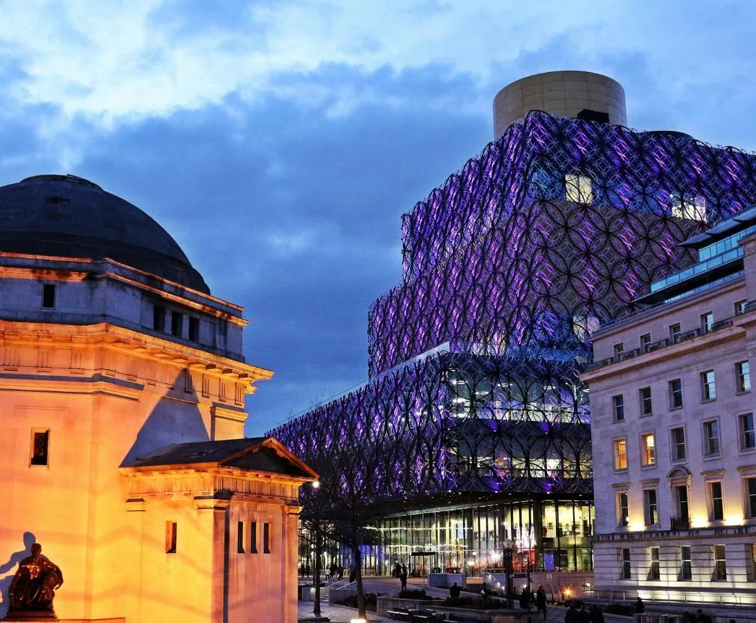 a building with a clock on the side of it at Crowne Plaza Birmingham City by IHG in Birmingham
