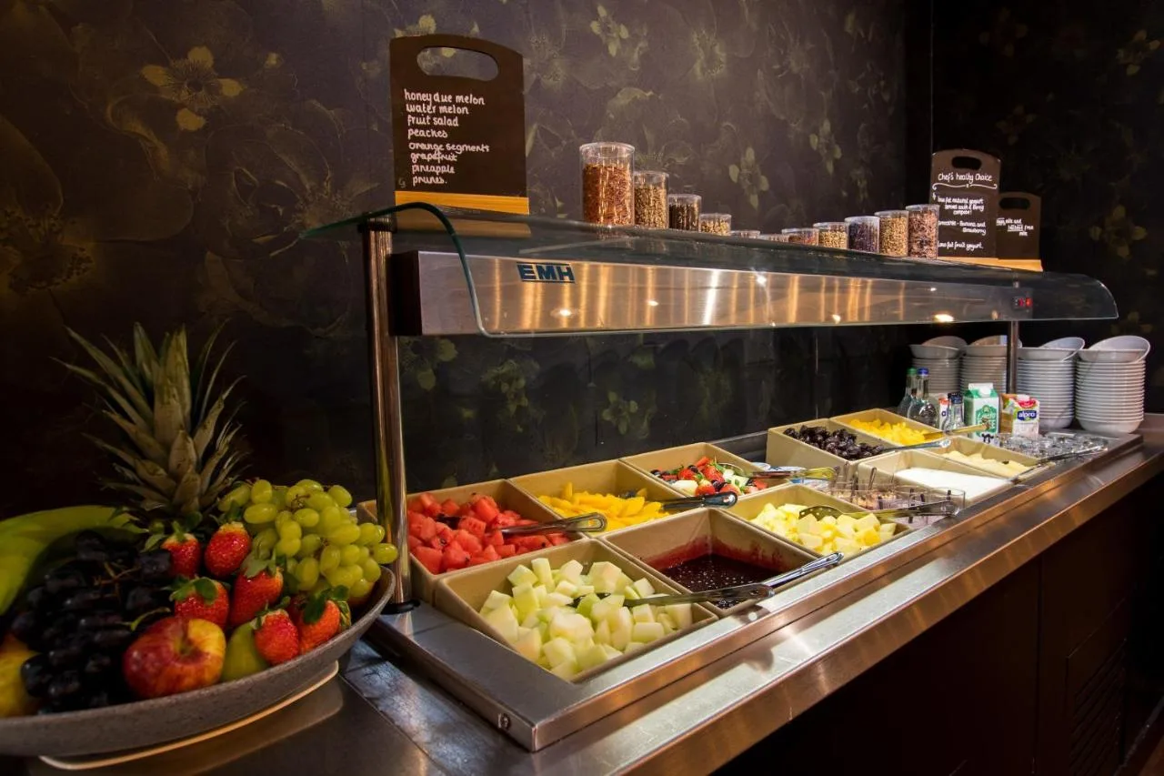 a display of fruits and vegetables on a counter at Crowne Plaza Birmingham City by IHG in Birmingham